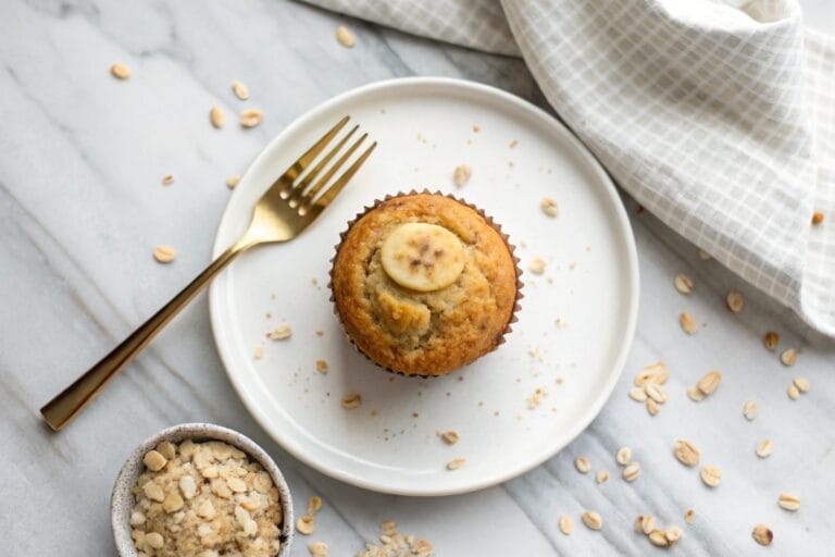 High protein banana muffin on a white plate