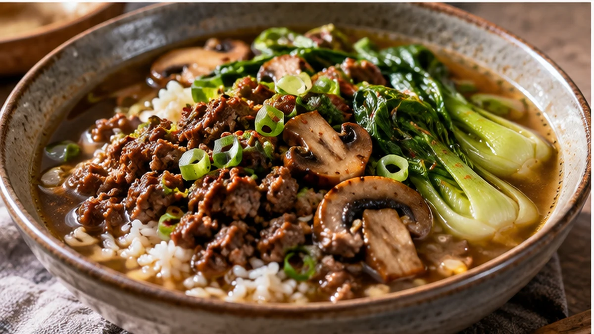 Savory ground beef broth bowl with rice, mushrooms, bok choy, and scallions
